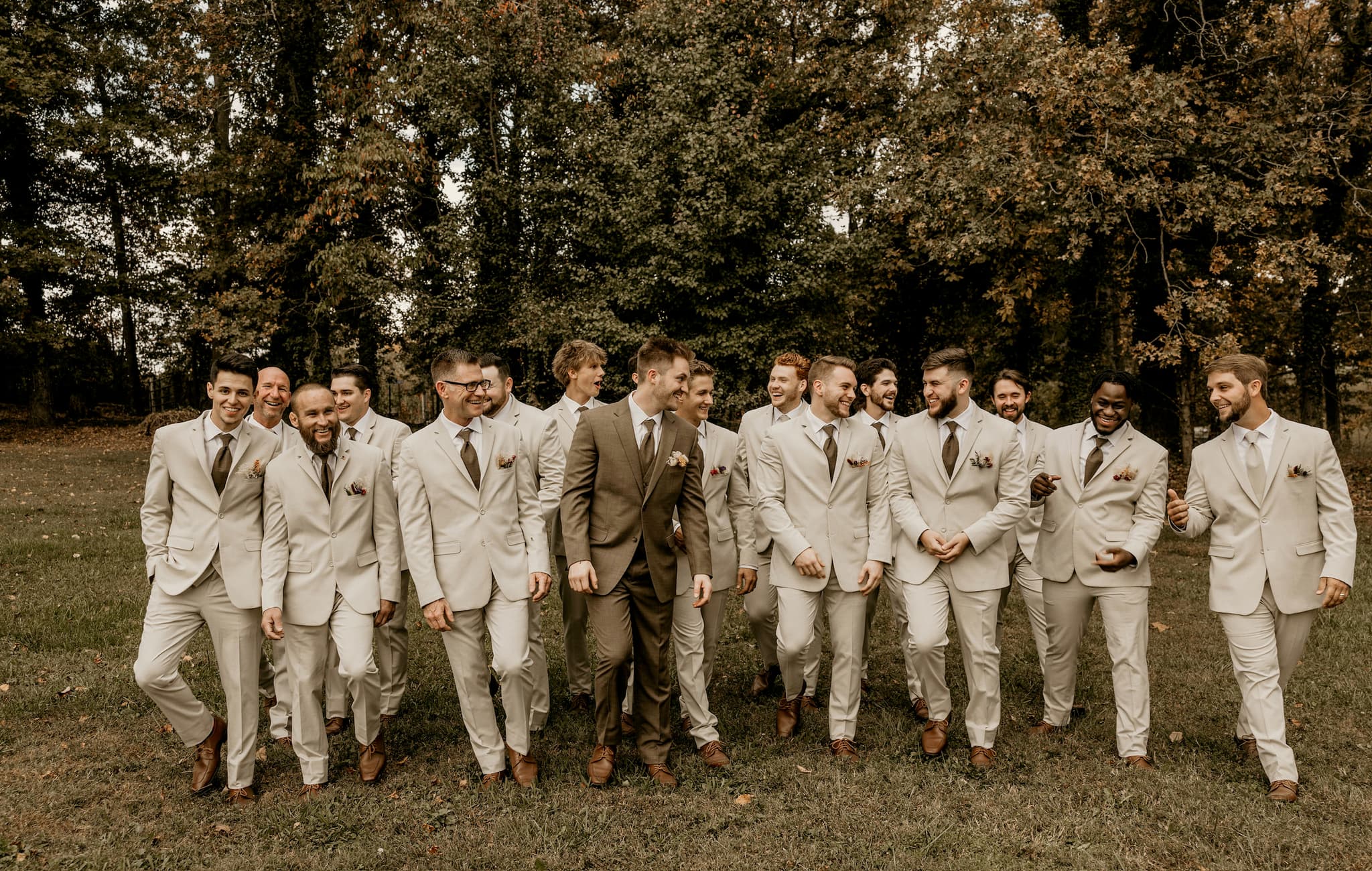 Group of young men in coordinated formal suits