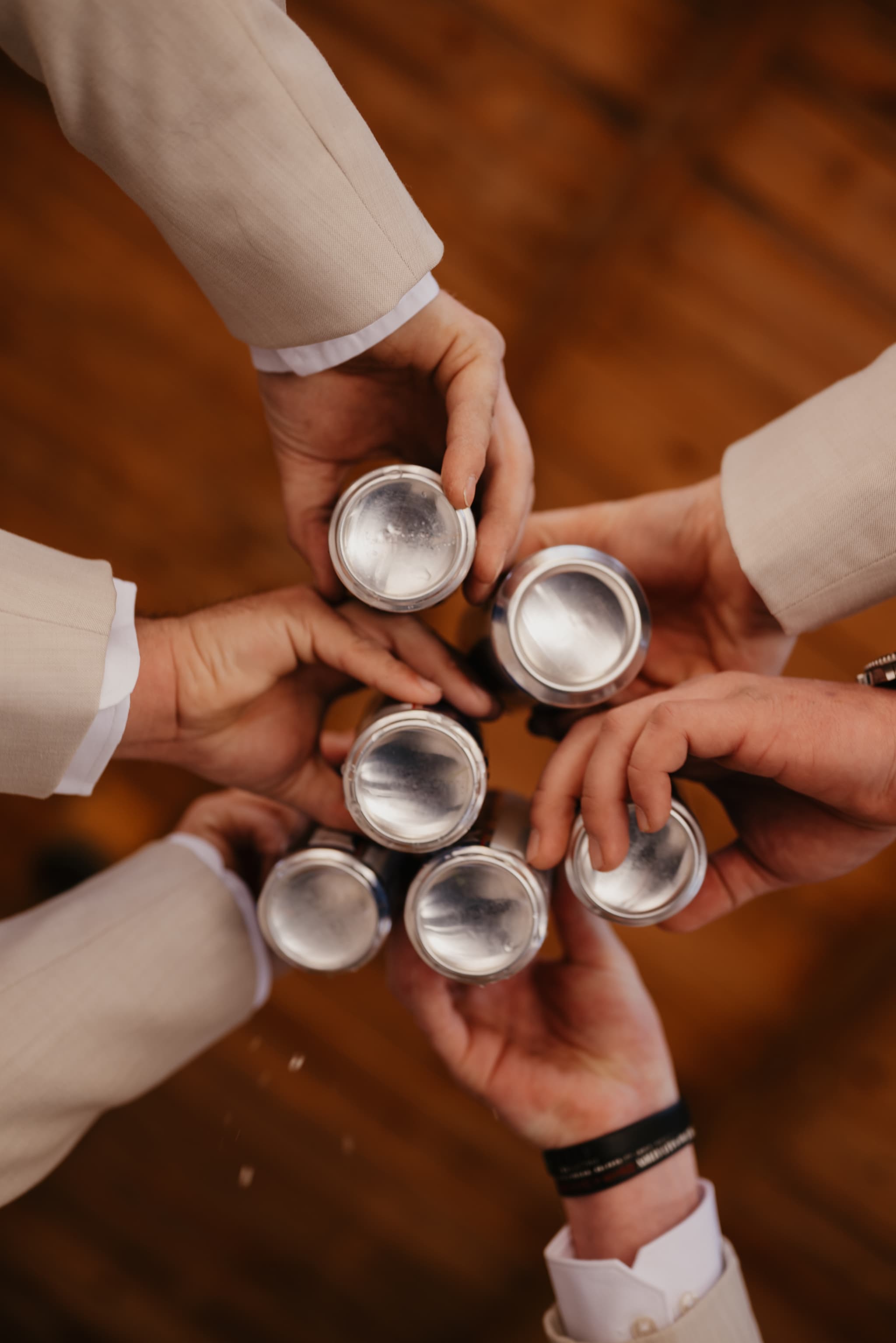 Groomsmen toasting with drinks on the big day
