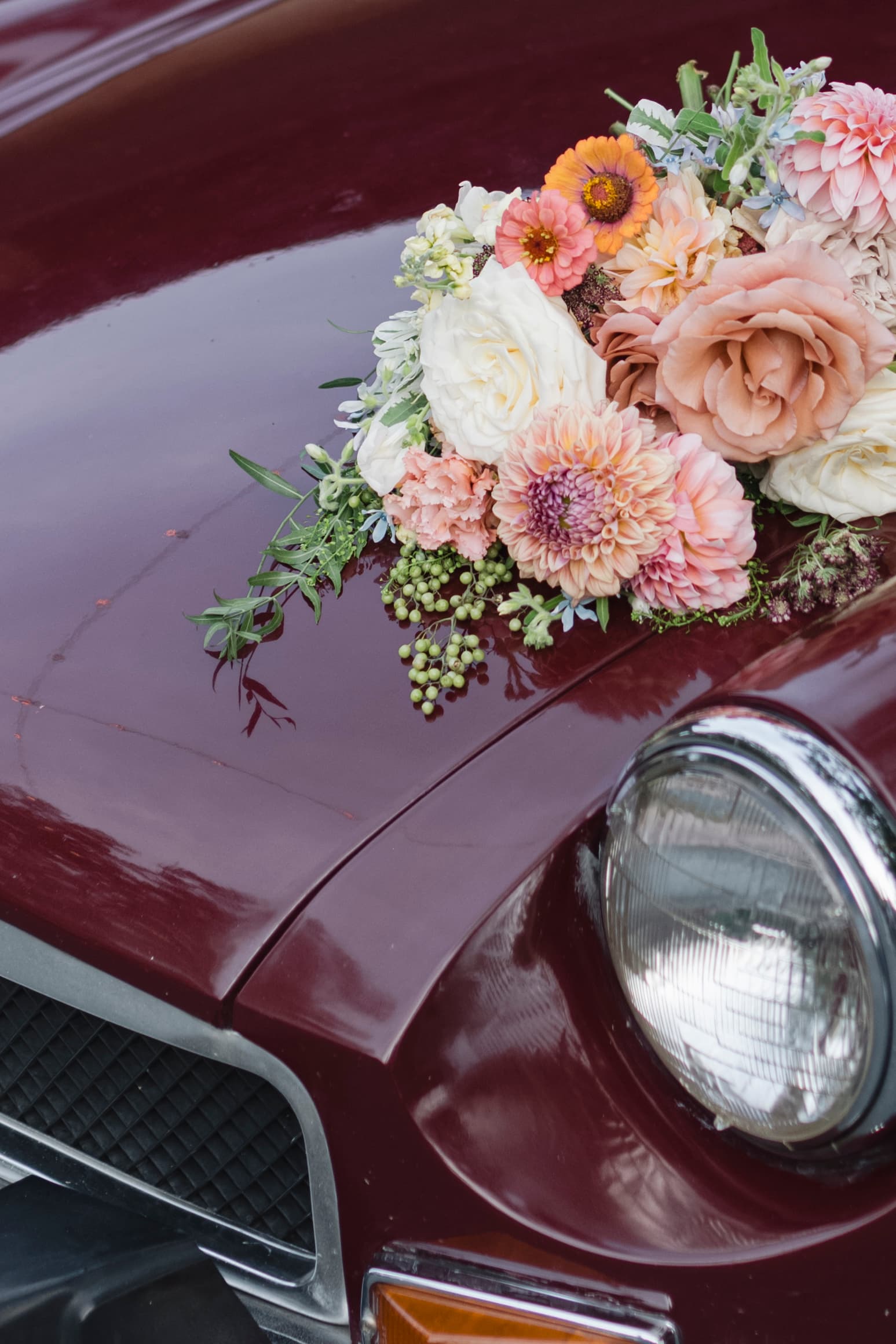 Vintage wedding car decorated with flowers