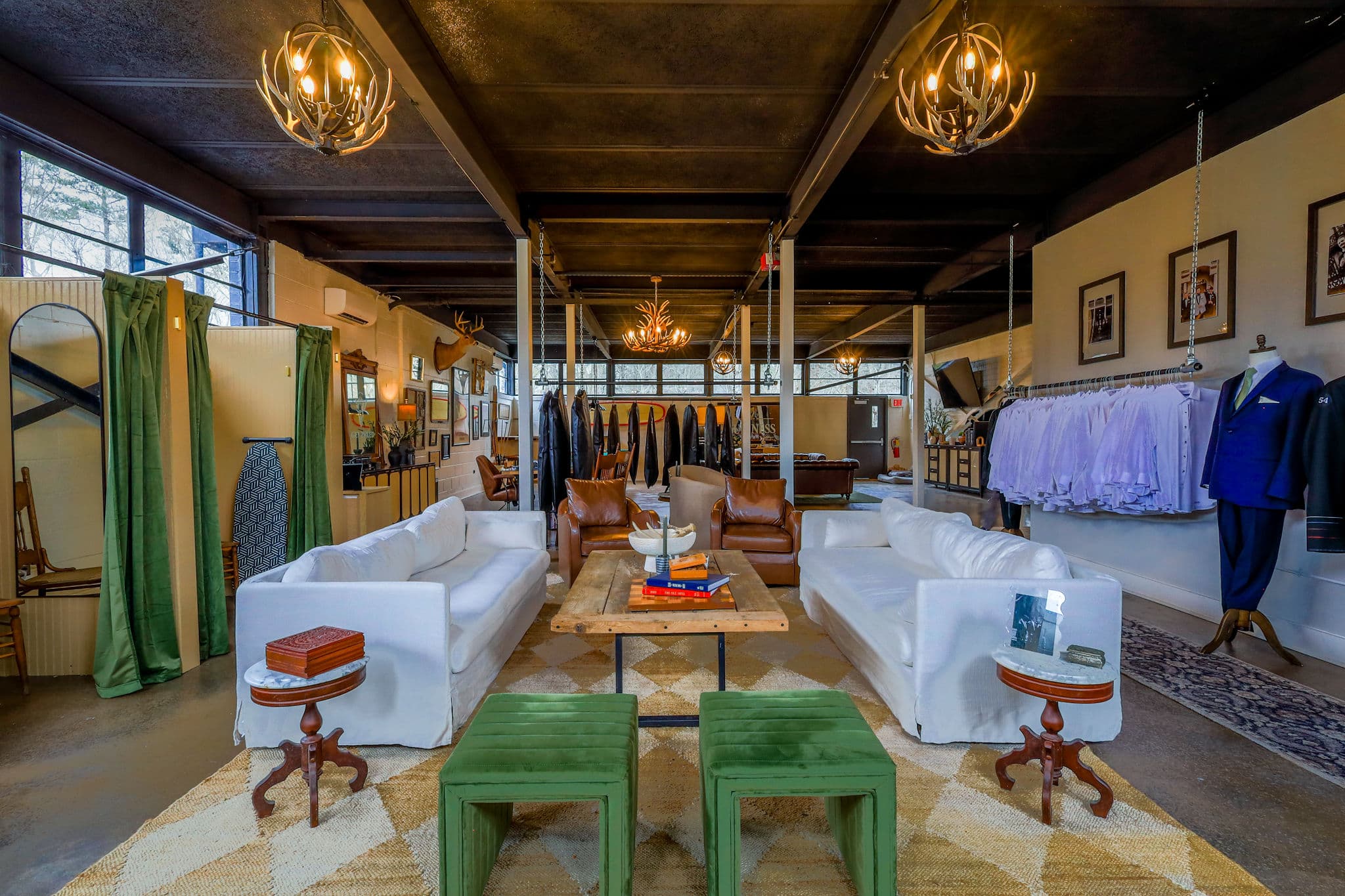 Suits and tuxedos displayed in the Get Tuxed showroom